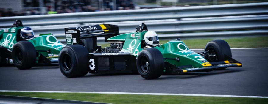 man riding on racing car